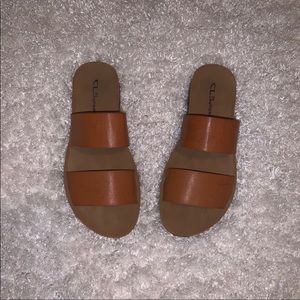 Burnt orange slip-on flats.